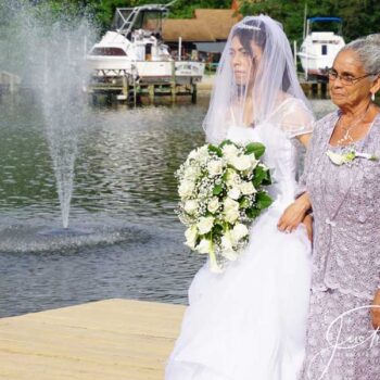 Bride with mother, waterfront wedding