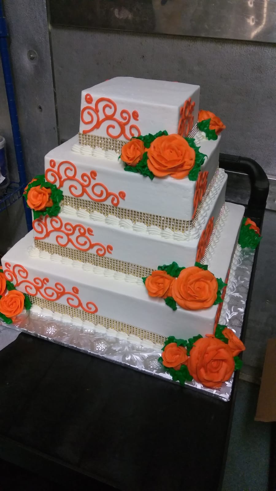 Orange and gold square tiered cake